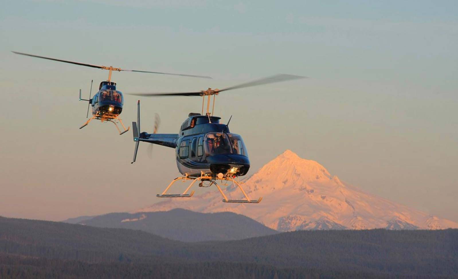 rotorcraft fuel sensors with two helicopters and Mt. Hood in the background